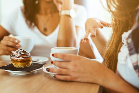 women discussing business over coffee.jpg